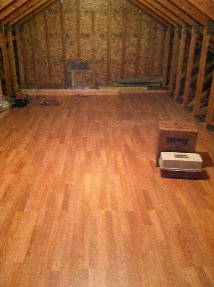 The bonus room above the garage is becoming an art studio & here's the laminate flooring