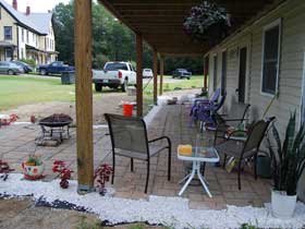 While expanding the patio to the northern end of the house, Susan decided to add space for a fire pit too.