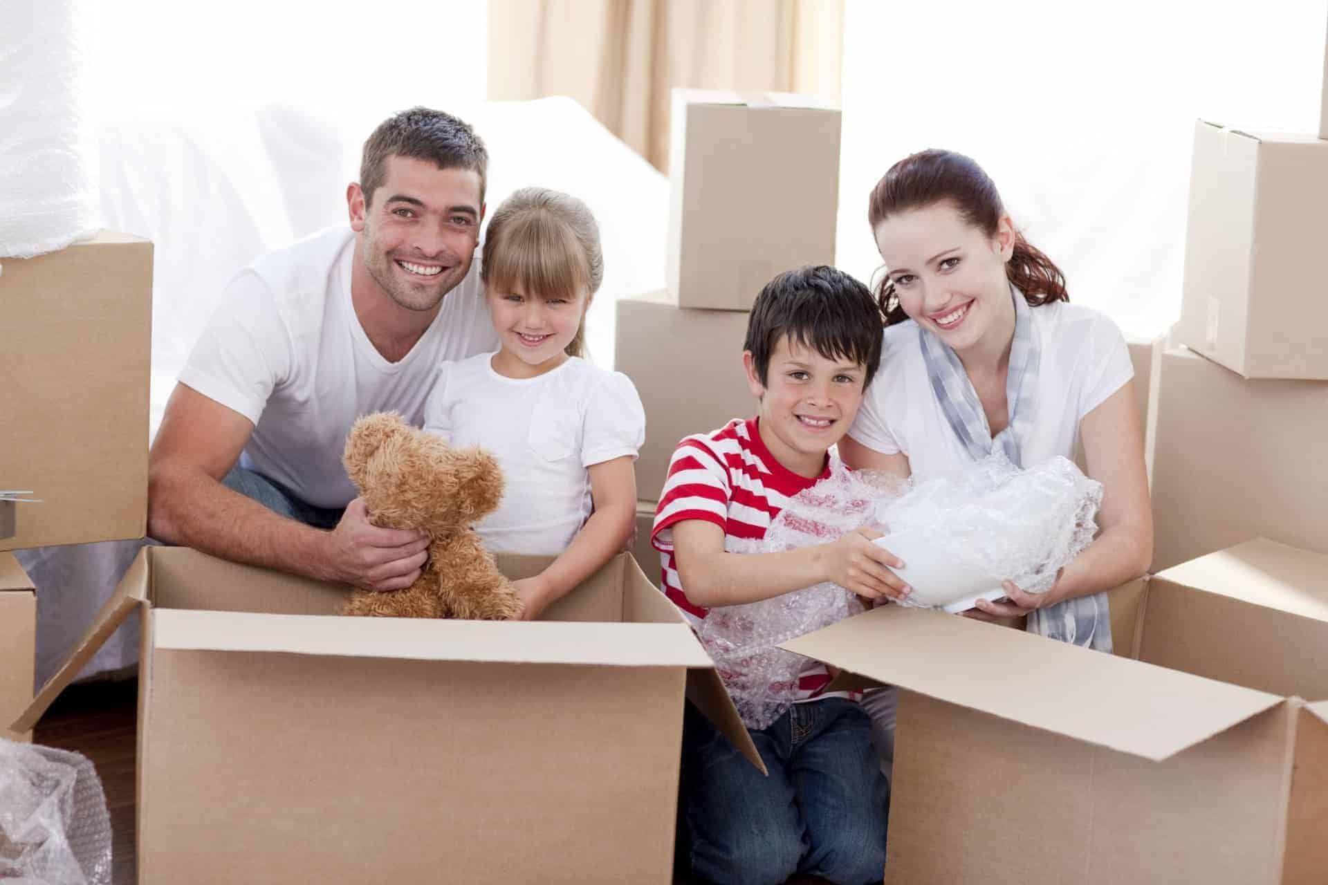 Family unpacking in their new home before tackling house upgrades