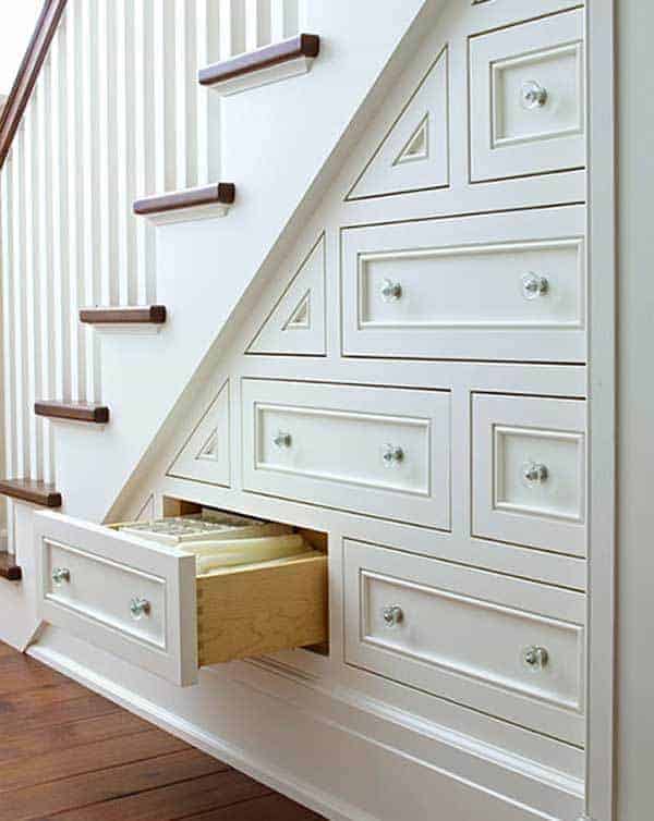 home remodels can create more storage space like these drawers under the stairs