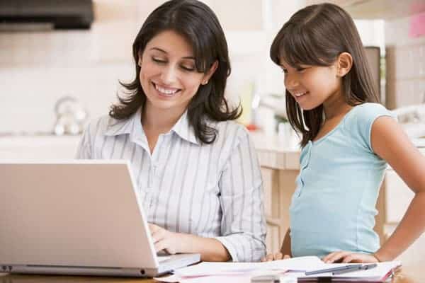 mother teaching daughter about homeowner budget