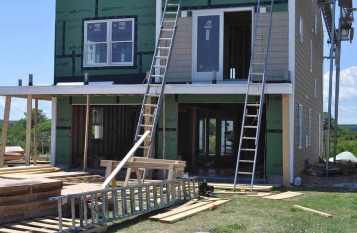 Home under construction shows lumber as #1 material & shortages now driving higher housing prices