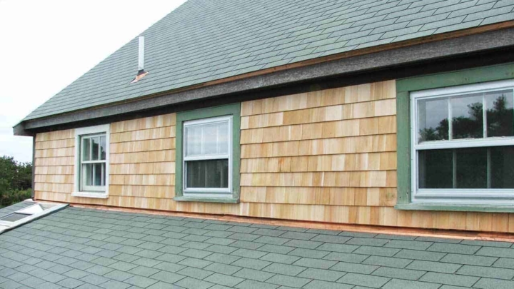 there are many layers hidden behind your home's exterior, each feature playing a role like flashing that guides water past seams where the siding & roofing meet in this photo