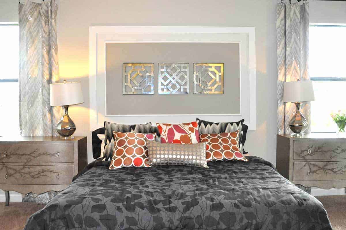 you can refresh your space with color, like these bright pillows against a neutral bedspread