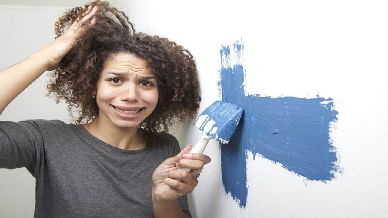 the blue paint colors and lighting are causing this woman stress