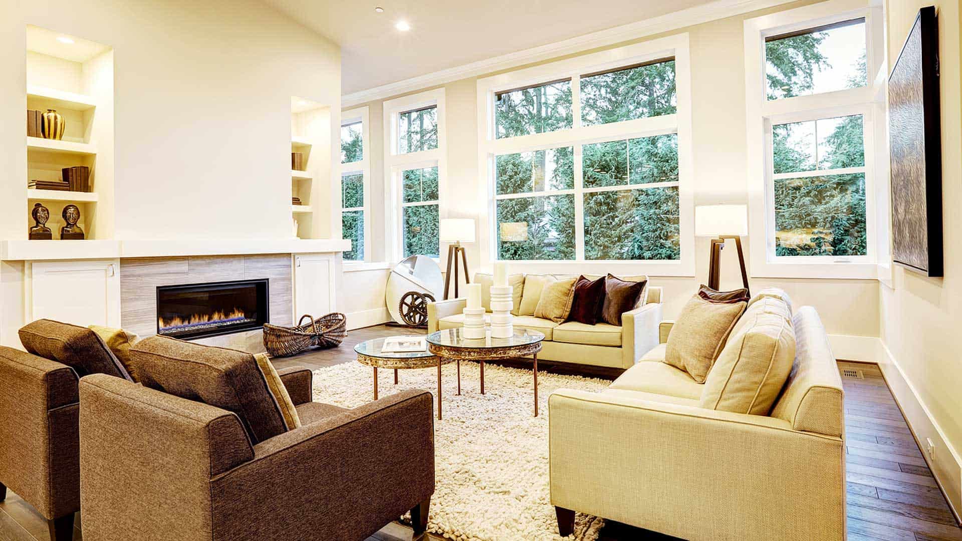 Built-in bookshelves & cabinets on either side of the fireplace in this relaxing living room