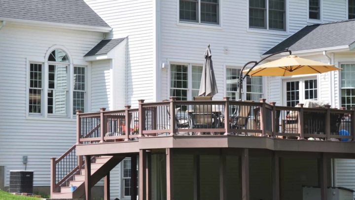 Attached deck raised about 6 ft off the ground, in contrast to floating decks that aren't attached to a structure