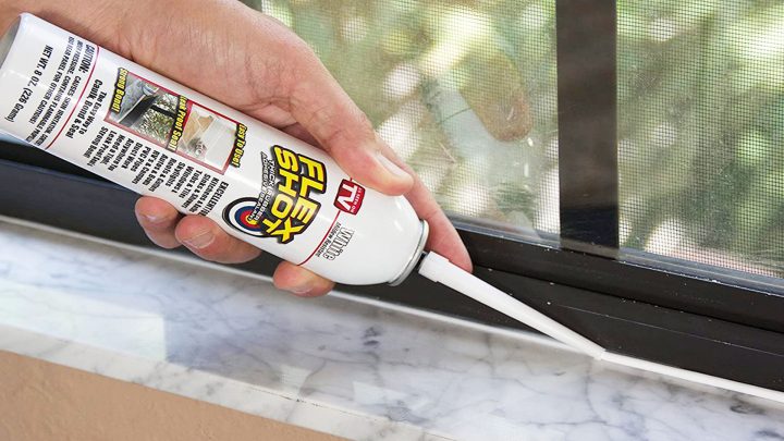 Caulking a window using a new style caulking tube (no caulking gun needed) ...