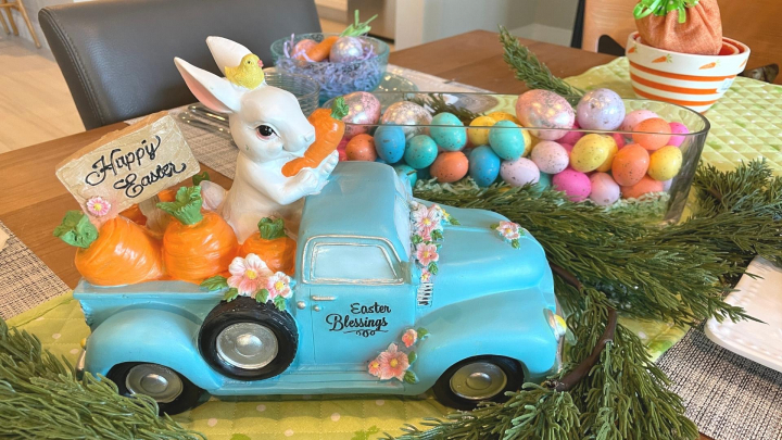 Colorful Easter table centerpiece with bunny & carrots in an old fashion truck ...