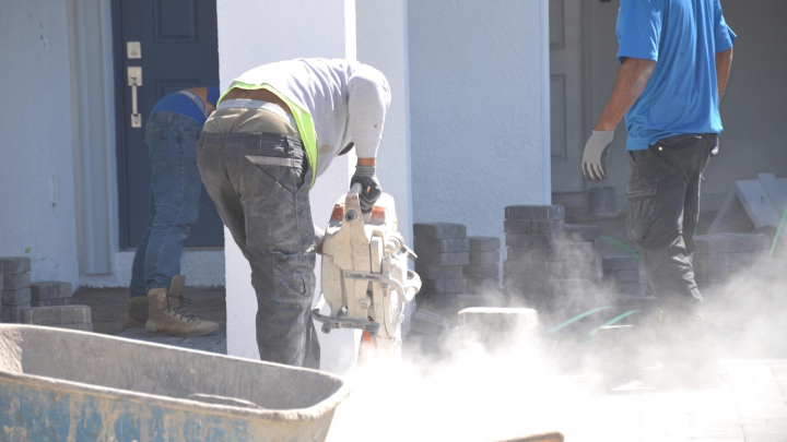 Skyrocketing home insurance rates reflect claim costs including materials & labor to restore your house ... construction workers hard at work