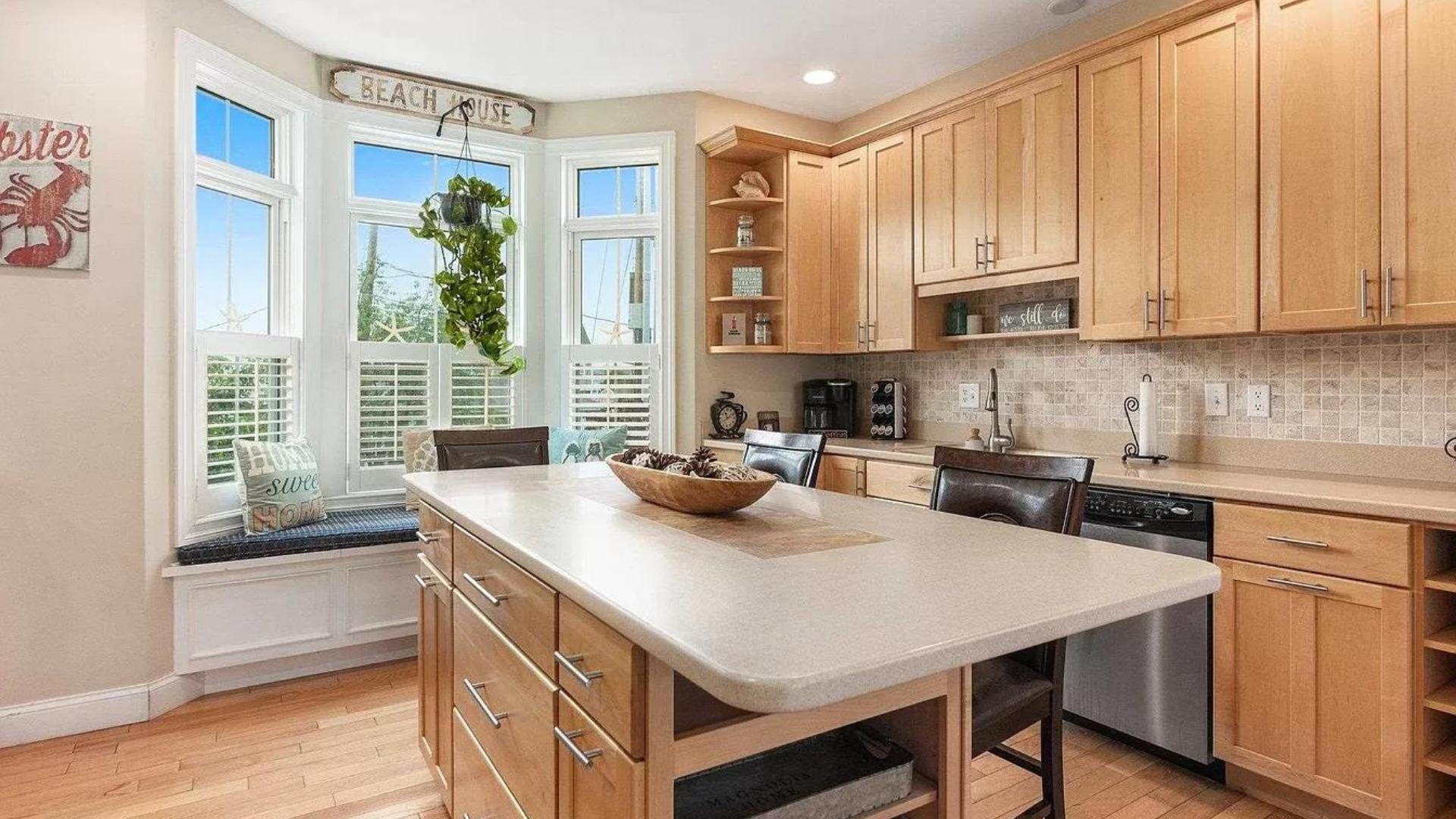 Rearranged this kitchen layout to include a kitchen island and window seat ...